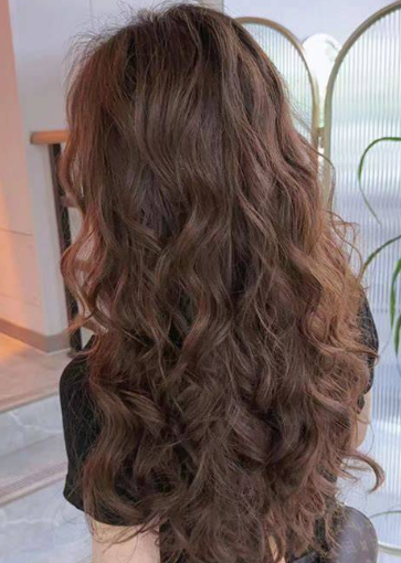 Use a curling iron to create a French-style lazy curl